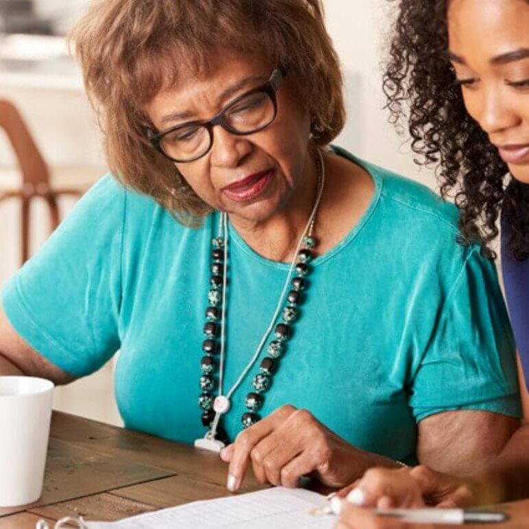About Us 2 Happy senior couple communicating while having coffee in the morning.